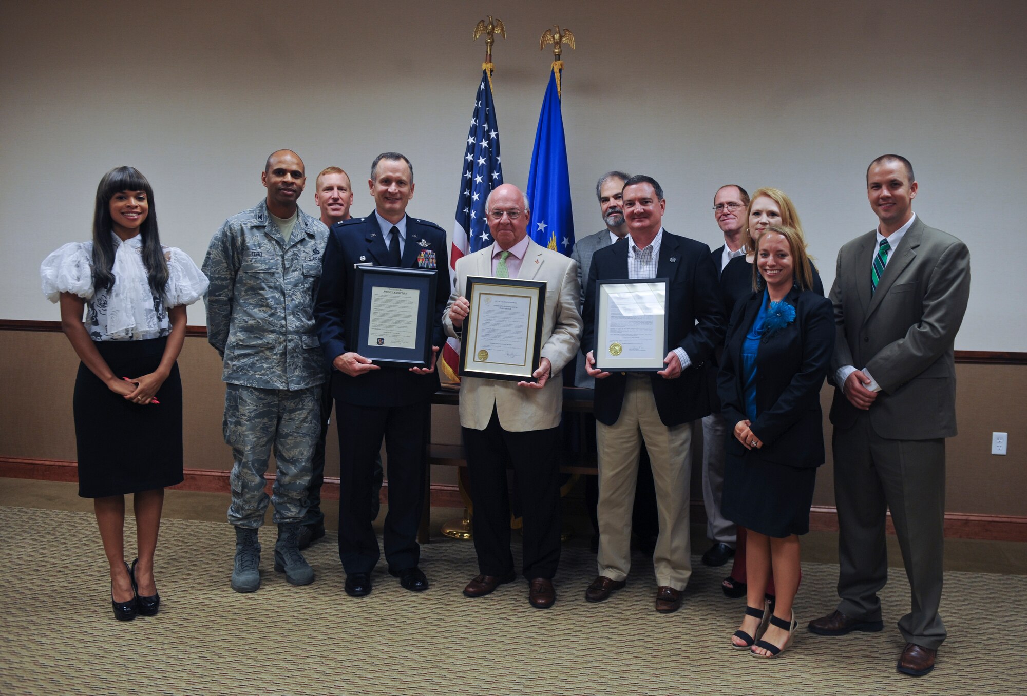 Moody leadership, Mayor John Gayle, and local planners of Valdosta pose for a photo at Moody Air Force Base, Ga., Sept. 20, 2012. Officials gathered to view the signing of the Community Planning Month Proclamation. (U.S. Air Force photo by Airman 1st Class Olivia Dominique/Released)