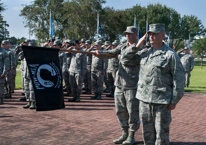 Airmen from Joint Base Charleston stand in formation during the Prisoner of War/Missing in Action Retreat ceremony Sept. 21, 2012, at Joint Base Charleston - Air Base, S.C. Several ex-POWs from the local area attended to pay their respects and to be honored for their sacrifices. (U.S. Air Force photo/Airman 1st Class Ashlee Galloway)