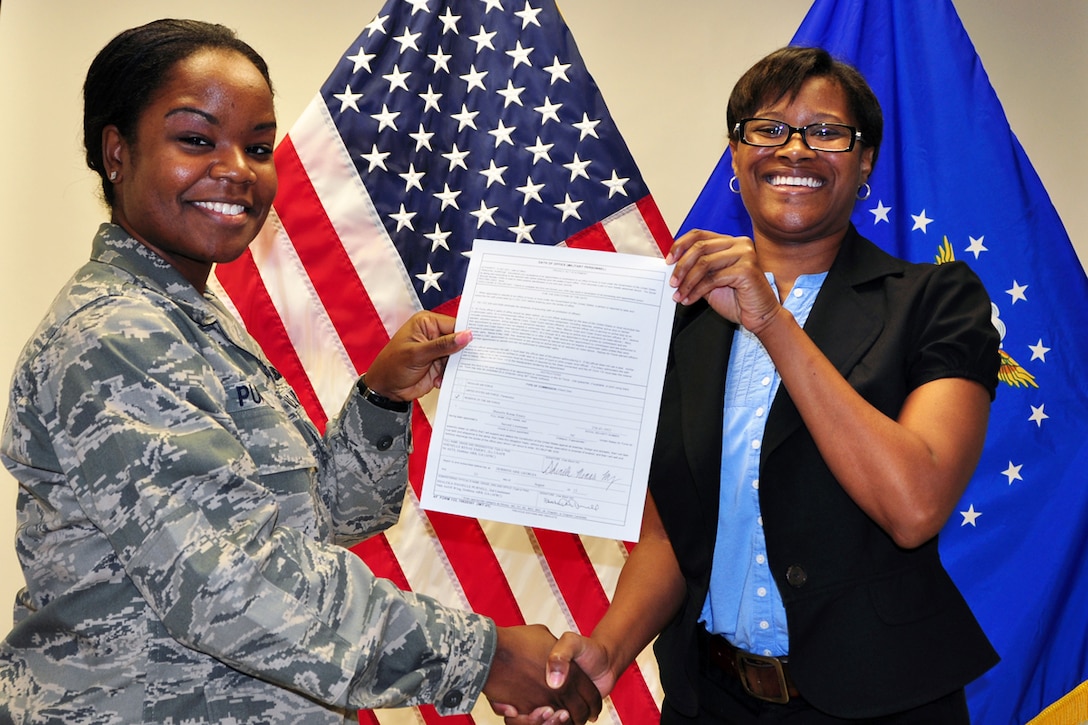 2nd Lt. Danielle Purnell led 2nd Lt. Shannell Emery in the U.S. Air Force Oath of Officer Aug 24. Emery will join the 94th Aeromedical Staging Squadron at Dobbins Air Reserve Base, Ga. (U.S. Air Force photo/Senior Airman Elizabeth Van Patten)