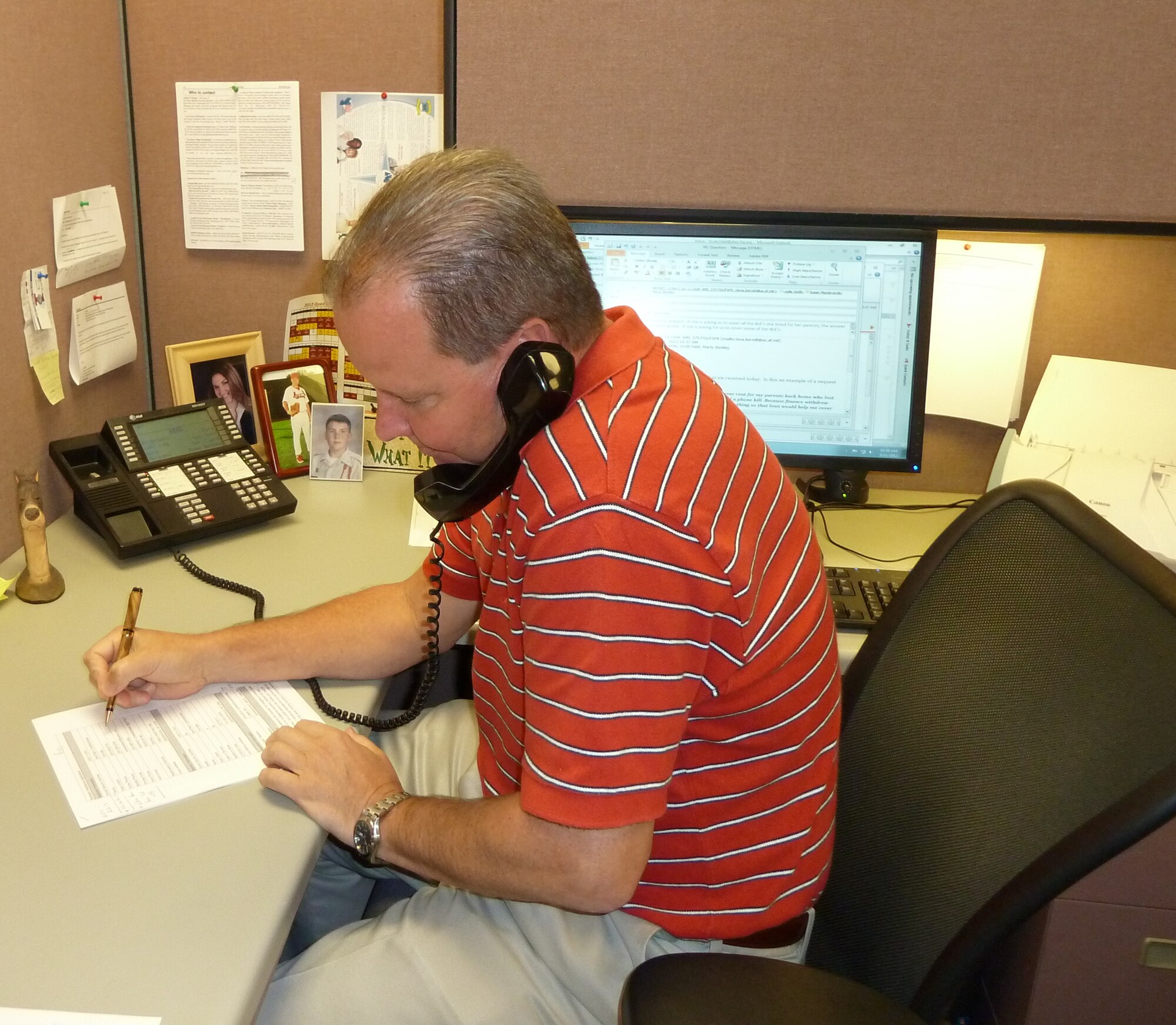 Scott Hald, an Air Force Aid Society emergency assistance caseworker, assists wounded warriors who need financial assistance in the form of grants or loans. (Courtesy photo)