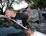 902nd  security forces members apprehend the suspected active shooter during the Joint Base San Antonio-Randolph active shooter exercise Sept. 17 and 18. (U.S. Air Force photo by Don Lindsey)