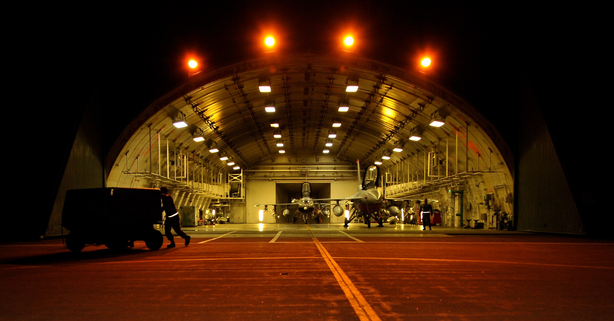 U.S. Air Force Airmen clear a hangar in preparation for the Pacific Air Forces Inspector General team during the Operational Readiness Inspection relook at Misawa Air Base, Japan, Sept. 25, 2012. The PACAF IG team thoroughly checked the 35th Fighter Wing’s ability to quickly and effectively prepare aircraft for combat during the relook. (U.S. Air Force photo by Staff Sgt. Nathan Lipscomb)