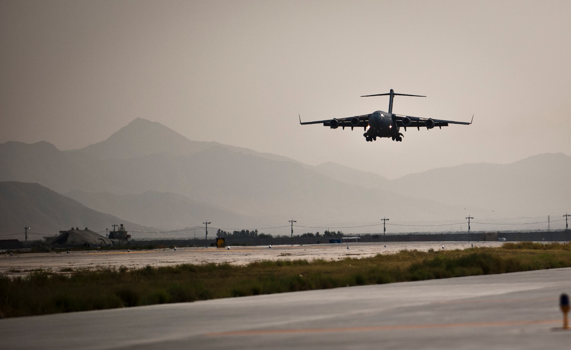 A U.S. Air Force C-17 Globemaster III lands at Bagram Airfield, Afghanistan, Sept. 25, 2012. The C-17 is capable of rapid strategic and tactical delivery of troops and any type of cargo to main operating bases or forward bases in Afghanistan. The aircraft can perform airlift, airdrop, and transport ambulatory patients during aeromedical evacuations when required. (U.S. Air Force Photo/Capt. Raymond Geoffroy)