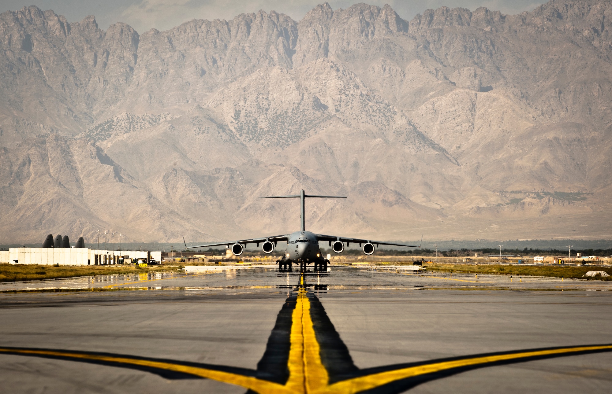 A U.S. Air Force C-17 Globemaster III taxis to its parking spot Bagram Airfield, Afghanistan, Sept. 25, 2012. The Globemaster III is a regular visitor to Bagram, transporting troops, equipment, and supplies in and out of Afghanistan. (U.S. Air Force Photo/Capt. Raymond Geoffroy)
