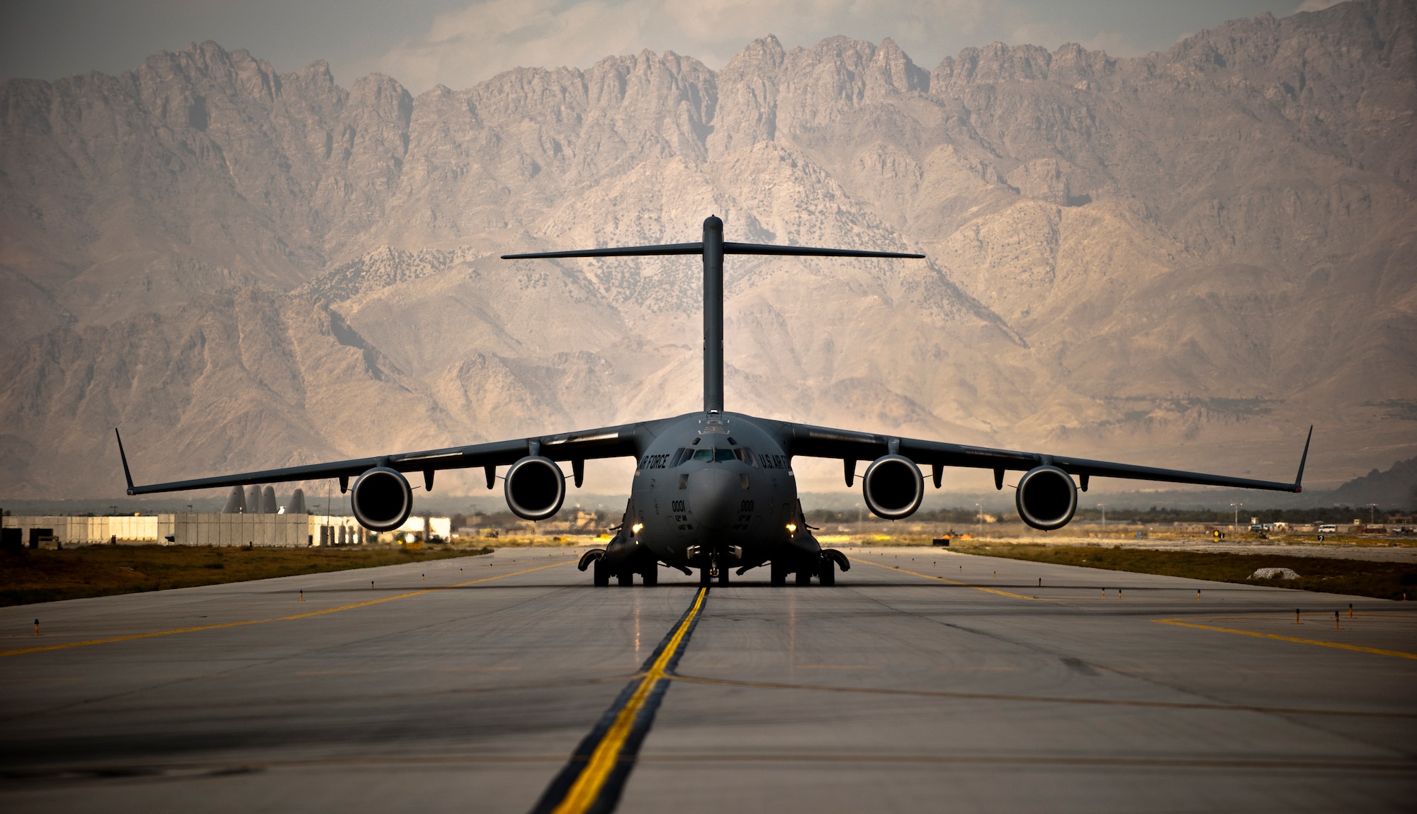 A U.S. Air Force C-17 Globemaster III taxis to its parking spot Bagram Airfield, Afghanistan, Sept. 25, 2012. The Globemaster III is a regular visitor to Bagram, transporting troops, equipment, and supplies in and out of Afghanistan. (U.S. Air Force Photo/Capt. Raymond Geoffroy)