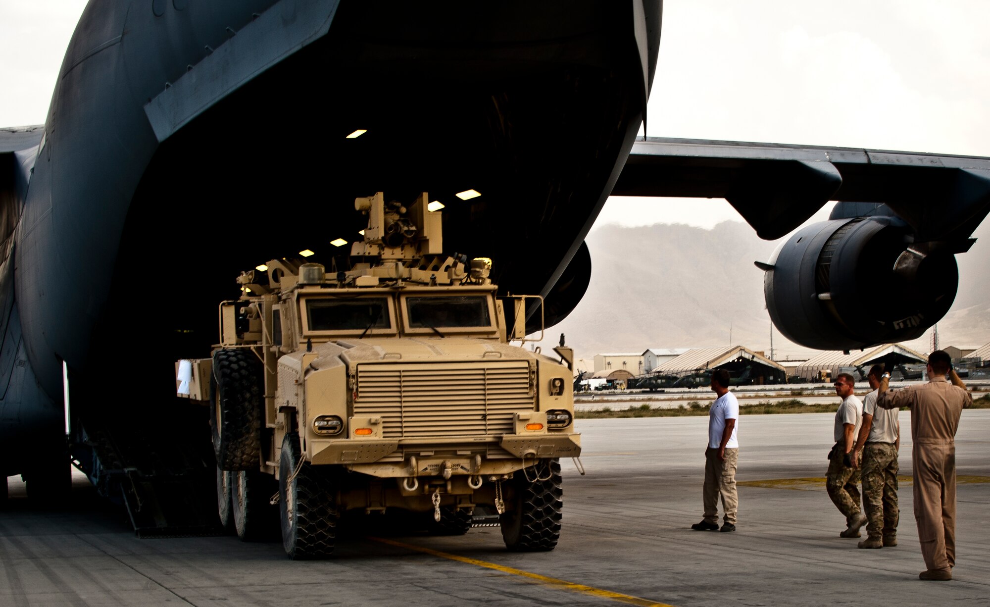 Airmen offload a Mine Resistant Ambush Protected tactical vehicle from a U.S. Air Force C-17 Globemaster III at Bagram Airfield, Afghanistan, Sept. 25, 2012. The C-17 can carry virtually all of the Army's air-transportable equipment almost anywhere in the world. (U.S. Air Force Photo/Capt. Raymond Geoffroy)