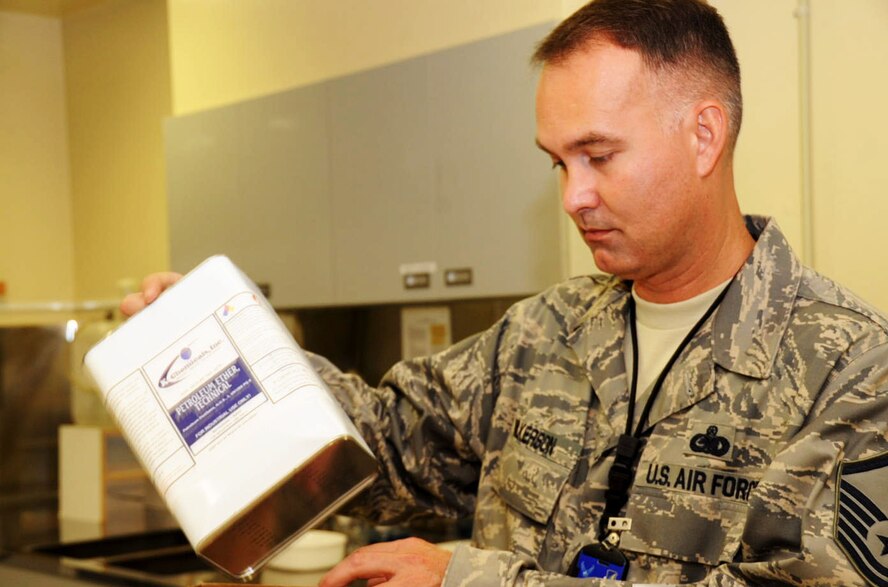 U.S. Air Force Master Sgt. Dustin Wilkerson, Pacific Air Force Inspector, studies a sealed can of petroleum ether during the consolidated unit inspection at Misawa Air Base, Japan, Sept. 20, 2012. Petroleum ether is used to perform sampling of various chemicals and to clean equipment. After the inspection, the PACAF IG team believed the 35th Fighter Wing was mission ready and gave a “Satisfactory” rating.(U.S. Air Force photo by Airman 1st Class Kenna Jackson)