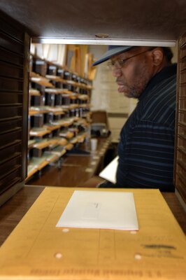 Phillip Sanford places mail into inboxes at the U.S. Army Corps of Engineers Nashville District Mail Room in Nashville, Tenn., July 31, 2012. Sanford was recently named Man of the Year at Roger Heights Baptist Church for stewardship and delivering good will.  (USACE Photo by Lee Roberts)