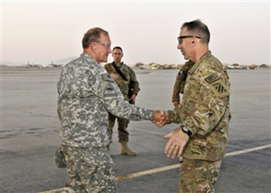 U.S. Army Maj. Gen. Robert B. "Abe" Abrams, commander of Regional Command South, welcomes U.S. Army Gen. Martin E. Dempsey, chairman of the Joint Chiefs of Staff, to Kandahar Airfield, Afghanistan, Sept. 25, 2012. Dempsey met with key Army leaders for the first time since they took command of the region earlier this month.