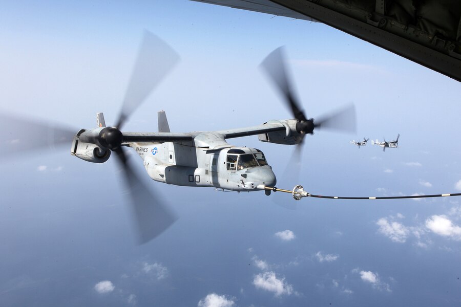 An MV-22B Osprey connects to the refueling hose of a KC-130J Hercules, during aerial refueling training Sept. 23, 2012. Both aircraft are with Marine Medium Tiltrotor Squadron 261 (Reinforced), 24th Marine Expeditionary Unit, and conducted aerial refueling training to practice the skills needed for long-range flight operations.  The 24th MEU is deployed with the Iwo Jima Amphibious Ready Group as a theater reserve and crisis response force for U.S. Central Command in the U.S. Navy's 5th Fleet area of responsibility.