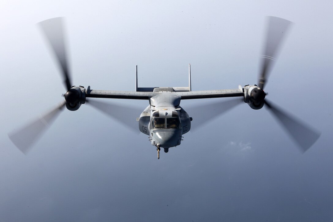 An MV-22B Osprey with Marine Medium Tiltrotor Squadron 261 (Reinforced), 24th Marine Expeditionary Unit, flies into position while conducting aerial refueling training operations, Sept 23, 2012. The training consisted of MV-22B Ospreys and AV-8B Harriers from the 24th MEU conducting aerial refueling with the 24th MEU's KC-130J Hercules planes to practice the skills needed for long-range flight operations.  The 24th MEU is deployed with the Iwo Jima Amphibious Ready Group as a theater reserve and crisis response force for U.S. Central Command in the U.S. Navy's 5th Fleet area of responsibility.