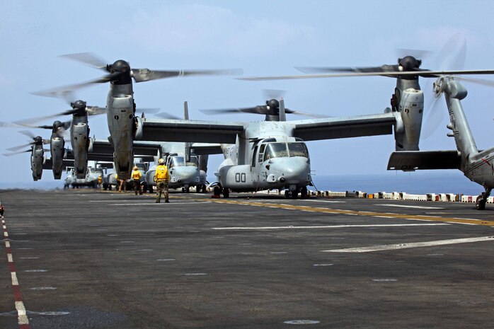 MV-22B Ospreys with Marine Medium Tiltrotor Squadron 261 (Reinforced), 24th Marine Expeditionary Unit, wait to take off from the flight deck of USS Iwo Jima (LHD 7) prior to conducting aerial refueling training operations, Sept 23, 2012.  The training consisted of MV-22B Ospreys and AV-8B Harriers conducting aerial refueling with the 24th MEU's KC-130J Hercules planes to practice the skills needed for long-range flight operations.  The 24th MEU is deployed with the Iwo Jima Amphibious Ready Group as a theater reserve and crisis response force for U.S. Central Command in the U.S. Navy's 5th Fleet area of responsibility.