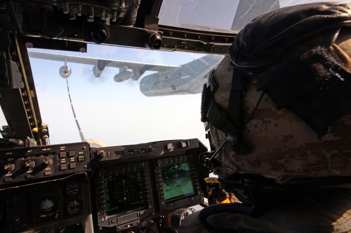 An MV-22B Osprey connects to the refueling hose of a KC-130J Hercules, during aerial refueling training Sept. 23, 2012. Both aircraft are with Marine Medium Tiltrotor Squadron 261 (Reinforced), 24th Marine Expeditionary Unit, and conducted aerial refueling training to practice the skills needed for long-range flight operations.  The 24th MEU is deployed with the Iwo Jima Amphibious Ready Group as a theater reserve and crisis response force for U.S. Central Command in the U.S. Navy's 5th Fleet area of responsibility. The KC-130J Hercules detachment is originally from Marine Aerial Refueler Transport Squadron 252, based at Marine Corps Air Station Cherry Point, N.C.
