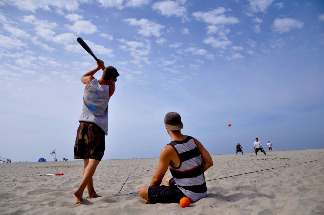 Participants from team "New Jack City" step up to bat during Camp Pendleton's Over-the-Line tournament at the Del Mar Beach, Sept. 22. The three players came out to the base's tournament to practice for the upcoming San Diego OTL tournament that attracts more than 1,200 teams.