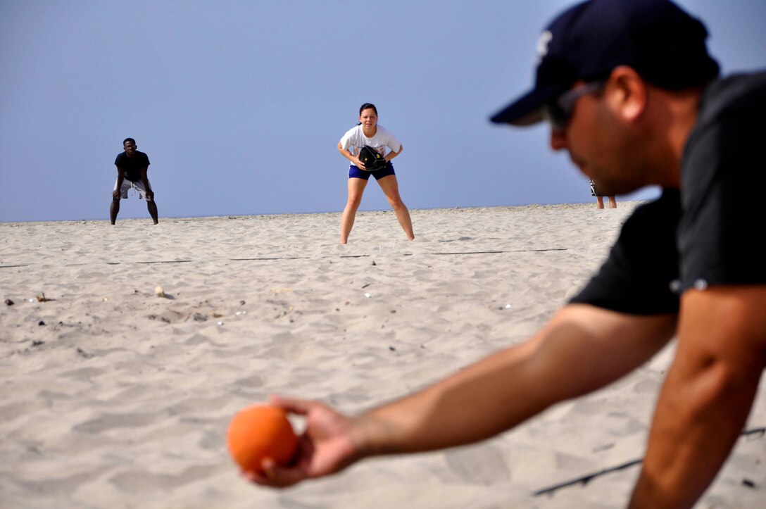 Tabitha Carter, captain of team Big Stix, stands ready in the field during the first elimination round of the first "Over the Line" tournament on Camp Pendleton's Del Mar Beach, Sept. 22. Carter was the only female in the all-male divisions of the competition, noting that her shop didn't have enough participants to make a regular softball team. Even being a female in the all-male portion of the competition, Carter was able to hang with the men, often times catching many line drives and scoring points for her team.