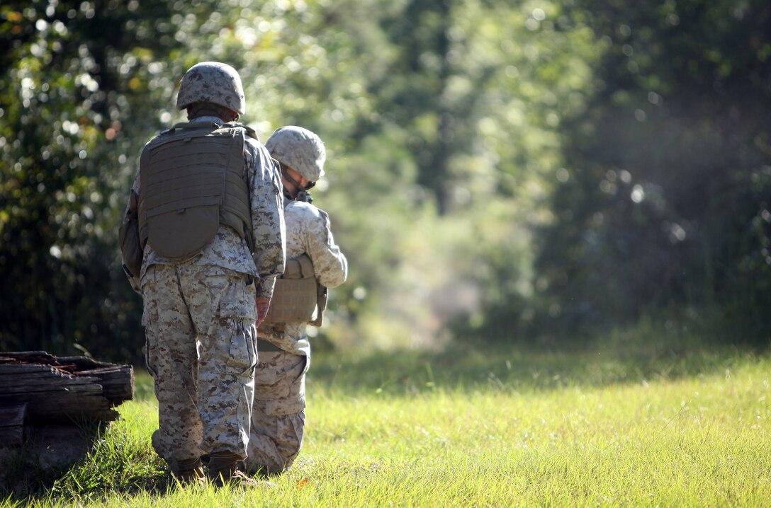 Lance Cpl. Elmo Hernandez, a bulk fuel specialist with 8th Engineer Support Battalion, 2nd Marine Logistics Group, and a fellow Marine engage a target during movement-to-contact training aboard Camp Lejeune, N.C., Sept. 25, 2012. During the training, 26 Marines with Bulk Fuel Company, 8th ESB maneuvered around team building obstacles to complete a course of 16 targets.