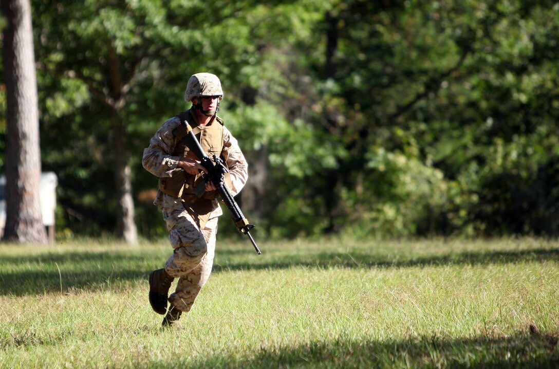 A Marine with 8th Engineer Support Battalion, 2nd Marine Logistics Group runs for cover during movement-to-contact training aboard Camp Lejeune, N.C., Sept. 25, 2012. The purpose of the training was to promote teamwork and combat marksmanship.