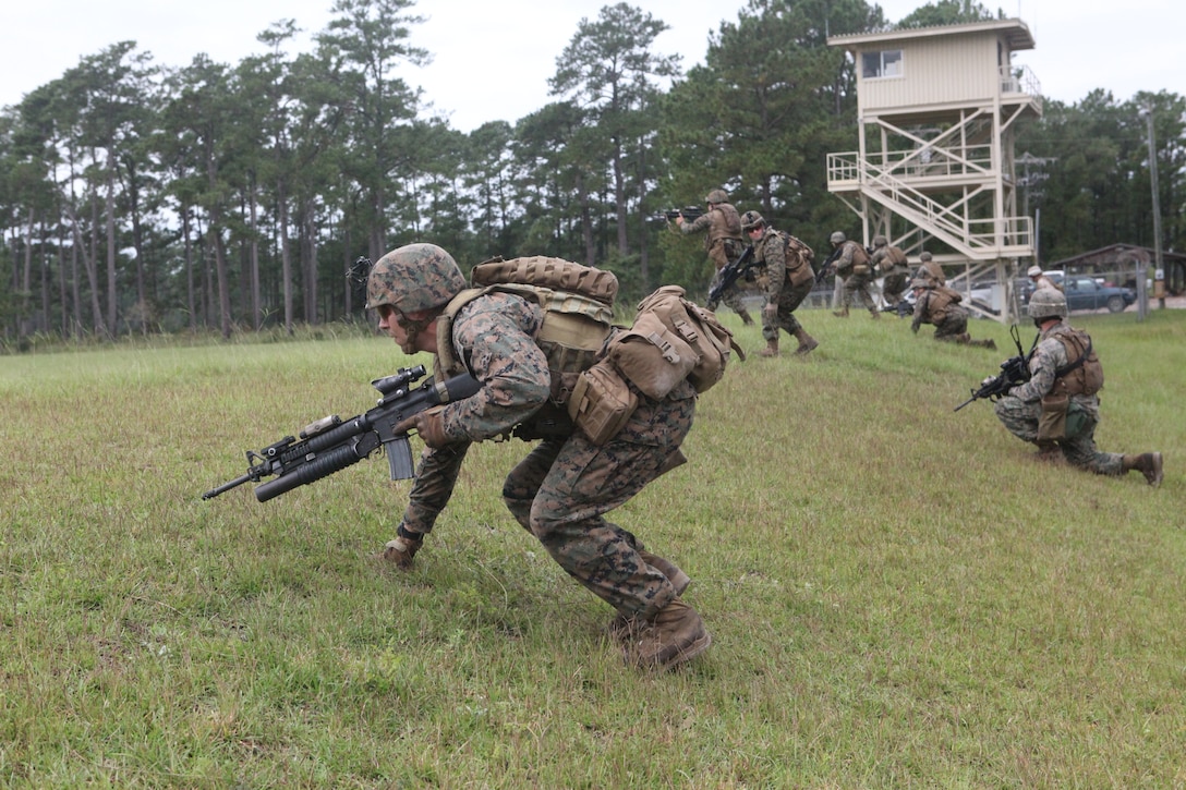 Marines from Marine Corps Base Camp Lejeune conduct a live-fire scenario exercise during the Infantry Small Unit Leader Course Sept. 19. The six-week course comprised of 17 sergeants from different units.