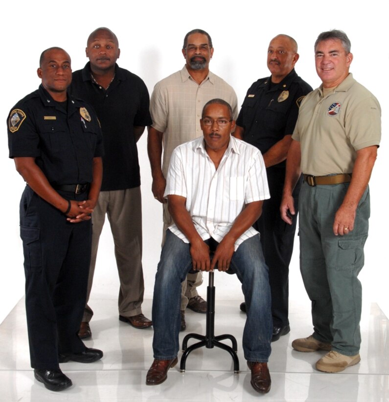 From left to right, Darwin O’Neal, Chief of Marine Corps Police Department aboard Marine Corps Logistics Base Barstow, Edwin Wisemon, administration officer with Fleet Support Division aboard the base, Robert Jackson, MCLB Barstow’s  public affairs officer, William Atkinson, deputy chief of MCPD aboard the base and Richard Holman, an instructor with Homeland Security Solutions Incorporated, pose for a group photo Sept. 20.  Each of the gentlemen, along with several others aboard MCLB Barstow, retired from the Marine Corps as master sergeants and now work in supervisory  roles aboard the installation.