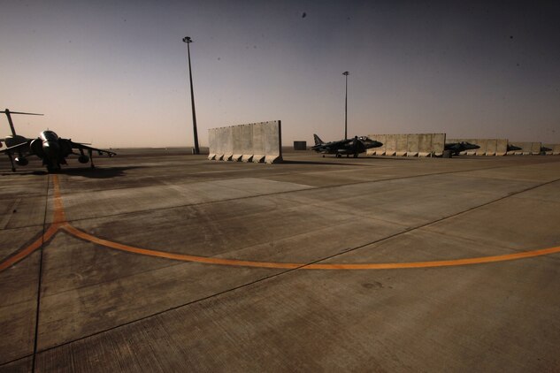 AV-8B Harriers line Camp Bastion?s airfield, Sept. 26. Despite a recent insurgent attack, which destroyed six aircraft, the squadron?s Marines know they have a job to do and intend to complete their mission and provide close-air support for Marines on the ground.