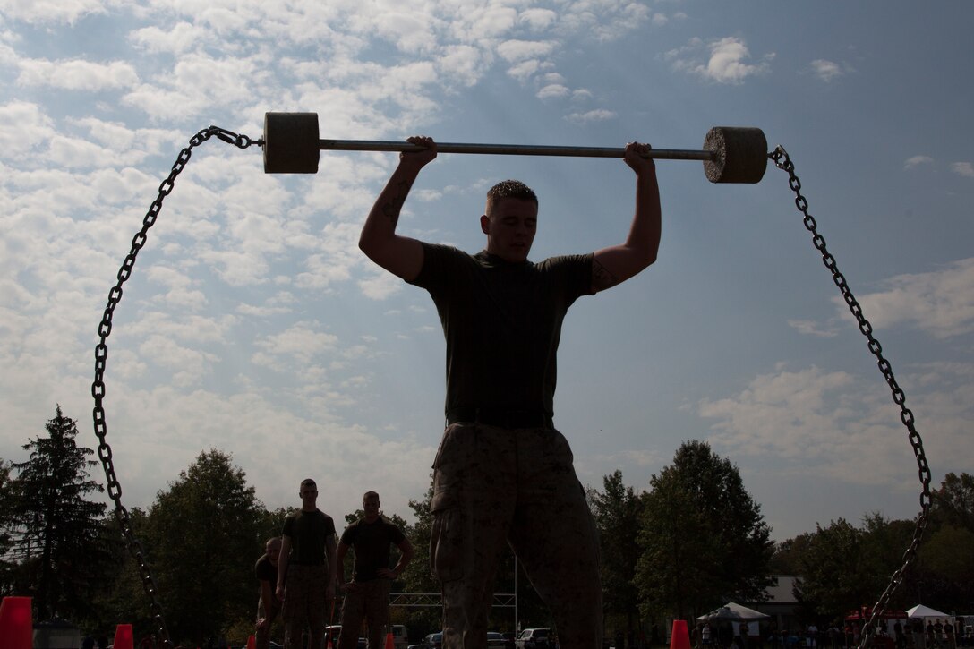 Lance Cpl. Barrett Dylan, a member of the silent drill platoon at Marine Barracks Washington, participates in the clean-and-press during the Prince George?s County Police Department?s 3rd Annual Iron Man Endurance Competition at T. Howard Duckett Park, Sept. 26. Police and fire departments, military members and federal government agencies from Prince George?s County and surrounding areas participated.