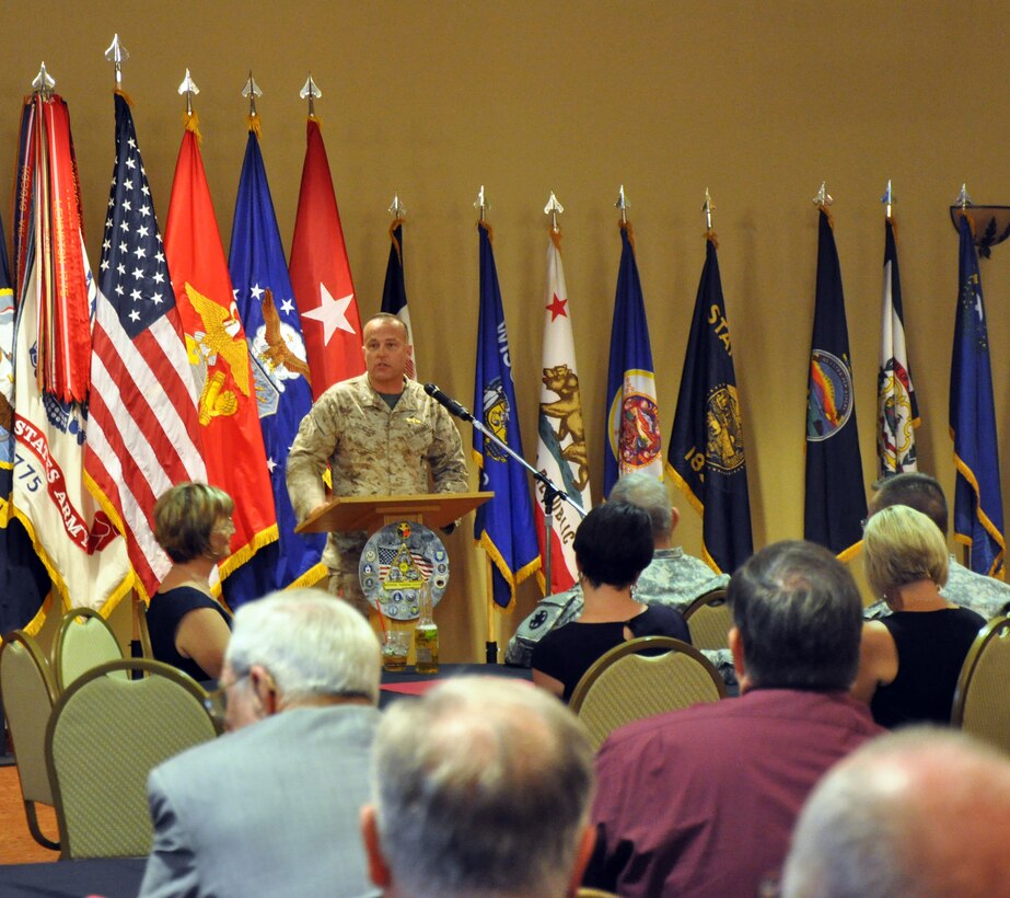 Colonel Michael Scalise, the commanding officer of Marine Corps Logistics Base Barstow, addresses the audience during the 23rd Annual Community Military Mixer at the Sandy Basin Community Center, Sept. 26. The military mixer provided new residents and employees the chance to socialize, network and relax in a friendly environment, while familiar faces strengthened their ties among service members and the High Desert community at large.