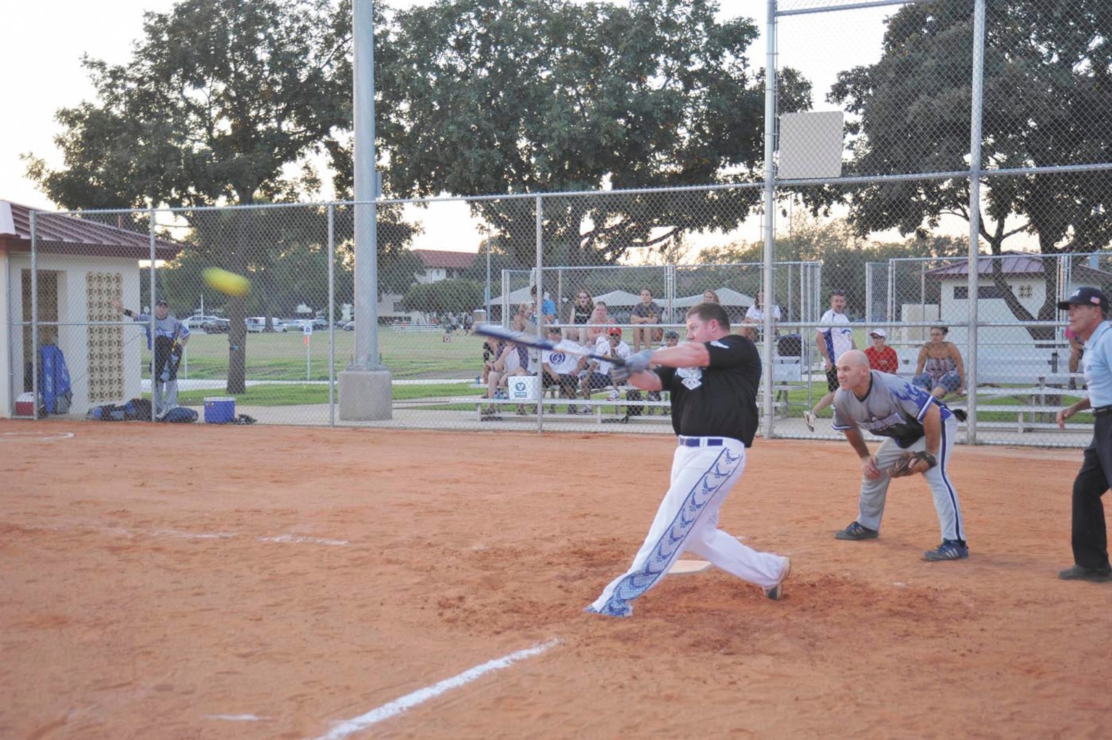 All-Air Force first baseman Josh Wiggs hits a home run in the sixth inning of the All-Air Force softball team’s exhibition game against the Joint Base San Antonio-Randolph, Texas, varsity team at JBSA-Randolph’s Rambler Field Sept. 6. (U.S. Air Force photo/Alan Boedeker)