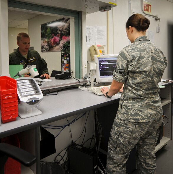 YOKOTA AIR BASE, Japan -- Staff Sgt. Rachael Evans, 374th Medical Support Squadron pharmacy technician, helps a customer at Yokota Air Base, Japan, Sept. 27, 2012. The pharmacy serves 11,000 beneficiaries, including active duty service members, dependants and civilians. (U.S. Air Force photo by Airman 1st Class Krystal M. Garrett)