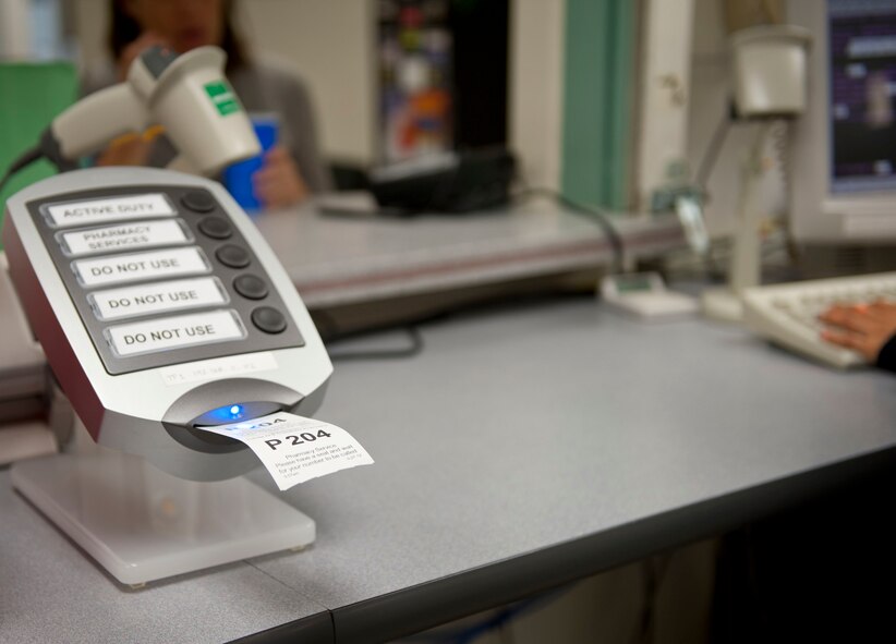 YOKOTA AIR BASE, Japan -- A ticket is printed for a customer at the pharmacy at Yokota Air Base, Japan, Sept. 27, 2012. Yokota pharmacy uses an electronic system, which keeps track of ready prescriptions and also notifies customers when their prescriptions are ready for pick up. (U.S. Air Force photoby 1st Class Airman 1st Class Krystal M. Garrett)