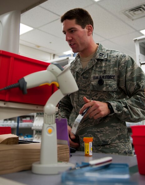 YOKOTA AIR BASE, Japan -- Capt. Lucas Gasco, 374th Medical Support Squadron chief of pharmacy operations, does a final check of a prescription at Yokota Air Base, Japan, Sept. 27, 2012. Prescriptions are checked several times to ensure the medication given is accurate. (U.S. Air Force photo by Airman 1st Class Krystal M. Garrett)