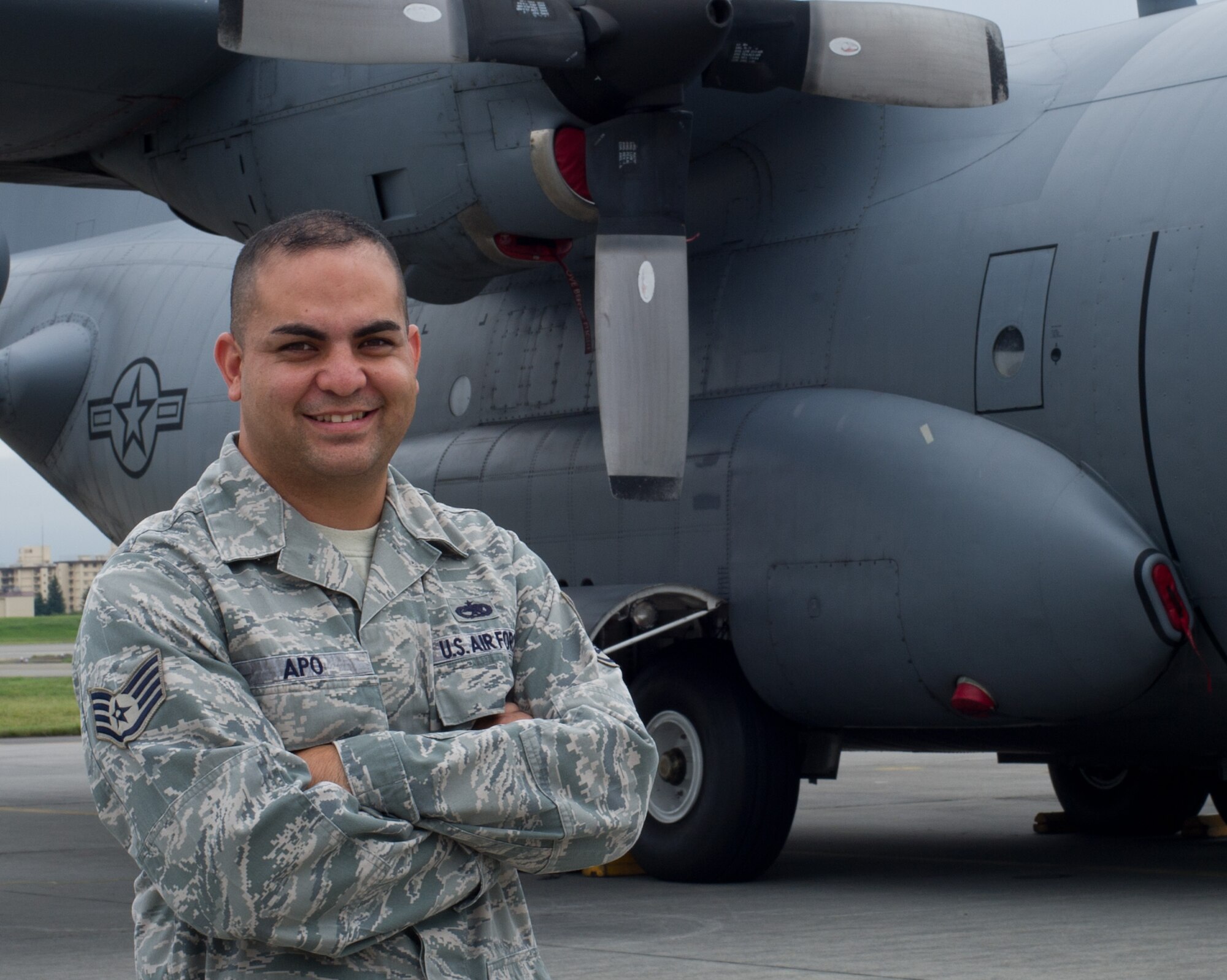 YOKOTA AIR BASE, Japan -- Staff Sgt. Galen Apo, 374th Maintenance Group quality assurance inspector, stands in front of a C-130 Hercules aircraft at Yokota Air Base, Japan, on Sept. 25, 2012. Apo's drive for aviation and education helped him get selected for Officer Training School. (U.S. Air Force photo by Senior Airman Andrea Salazar)