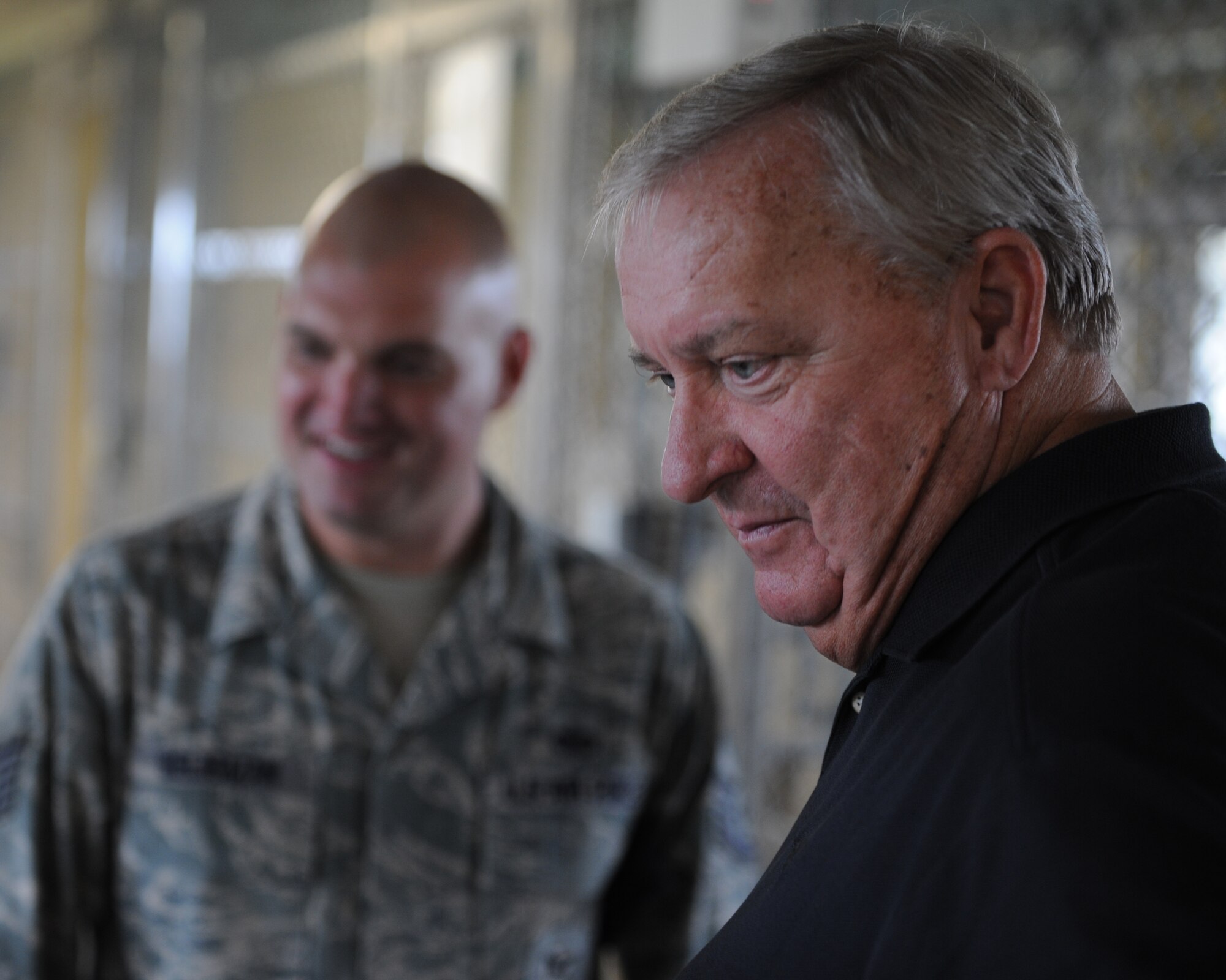 Former Chief Master Sgt. of the Air Force James Binnicker visits the newly refurbished 8th Security Forces Squadron canine kennels during a tour of Kunsan Air Base, Republic of Korea, Sept. 18, 2012. Binnicker, who served as the ninth CMSAF, spent much of the tour learning about the mission of the 8th Fighter Wing and the challenges Airmen stationed at Kunsan face. (U.S. Air Force photo/Staff Sgt. Jonathan Fowler)
