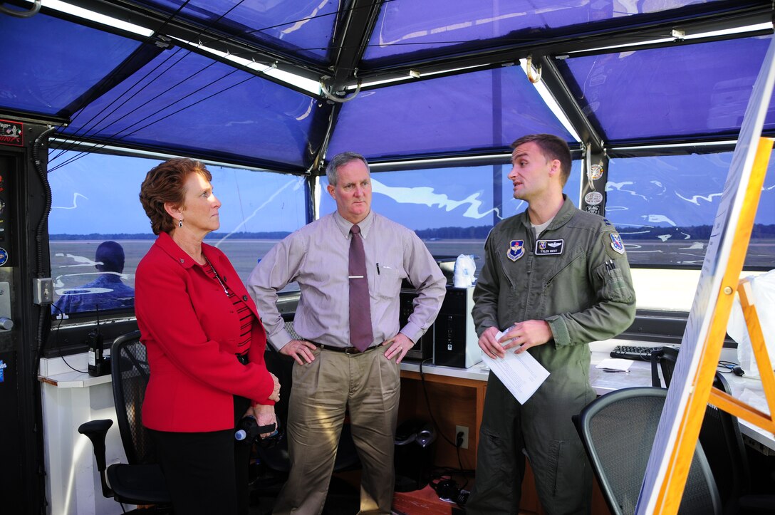 Barbra Sisson, Air Education and Training Command Director of Logistics, Installations and Mission support, and James Fitzpatrick, Deputy to the Command Civil Engineer, listen to Capt. Tyler West, 14th Operations Group give a briefing on the state of Columbus Air Force Base’s Runway Supervisory Units in a T-6 RSU. Sisson saw Team BLAZE and how it operates for the first time and was briefed on which base infrastructures are in most need of remodeling and modernizing. (U.S. Air Force photo/Melissa Doublin)