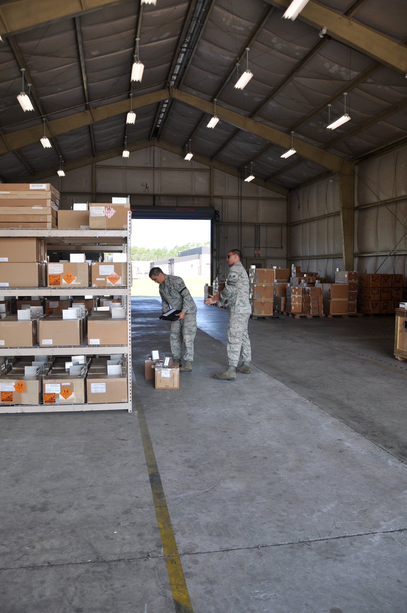 Staff Sgt. Colby Holmes, 325th Maintenance Squadron munitions storage crew chief, and Senior Airman Bennett Seymour, 325th MXS munitions storage crew member, store small arms and pepper spray in one of several storage facilities. (U.S. Air Force photo by Staff Sgt. Rachelle Elsea)

