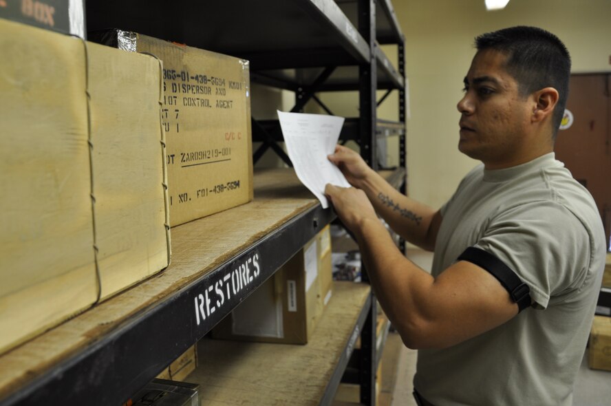 Staff Sgt. Alexandro Jauregui, 325th Maintenance Squadron munitions inspector, takes inventory. (U.S. Air Force photo by Staff Sgt. Rachelle Elsea)

