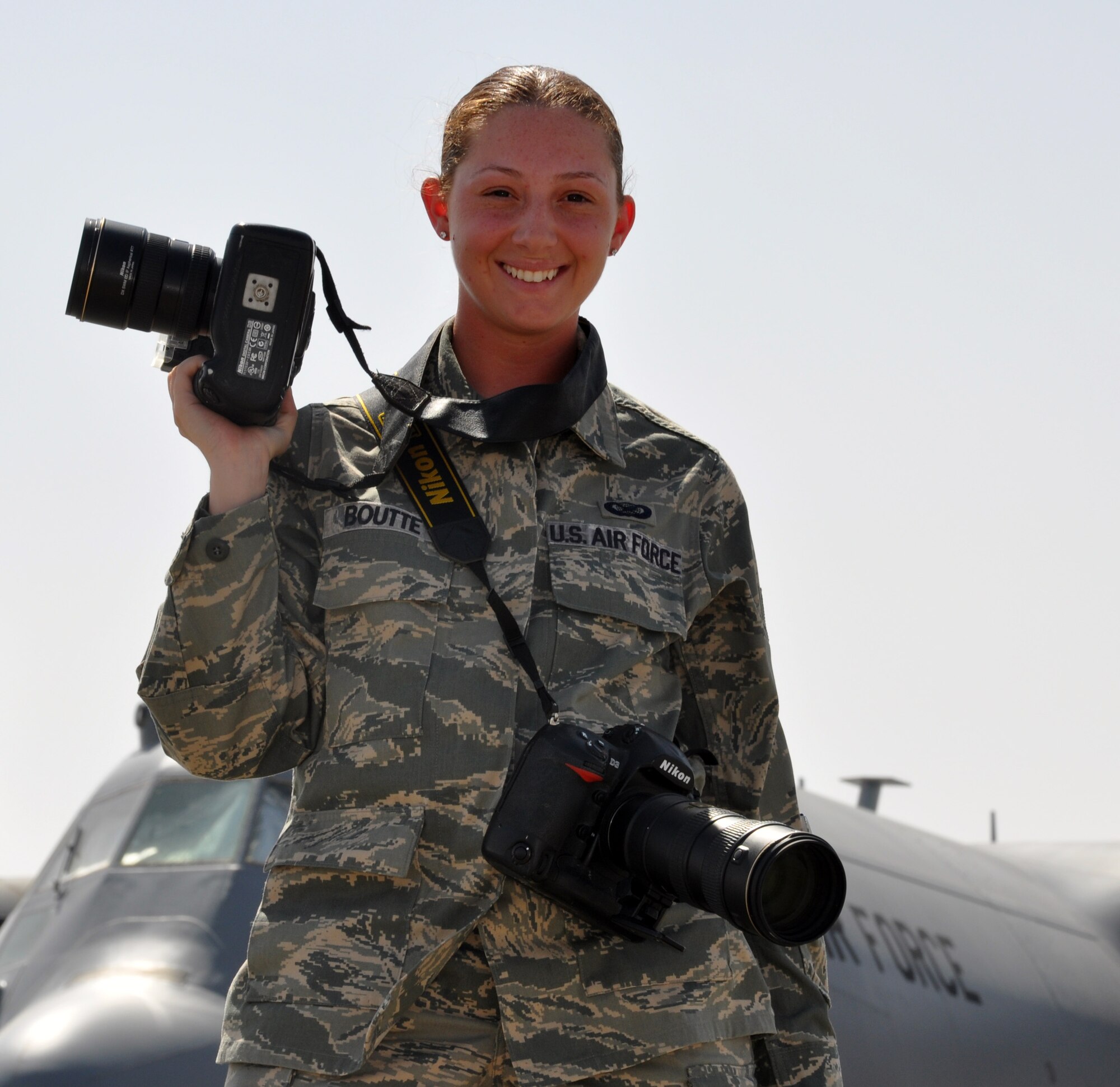 Staff Sgt. Alexandra Boutte, 386th Air Expeditionary Wing Public Affairs, prepares to photograph activity on the flightline. Sergeant Boutte’s job is telling the stories other service members through photography, both stateside and on the frontlines. She is a photojournalist deployed from the 509th Bomb Wing Public Affairs office. (U.S. Air Force photo/Master Sgt. Kristina Barrett) (RELEASED)