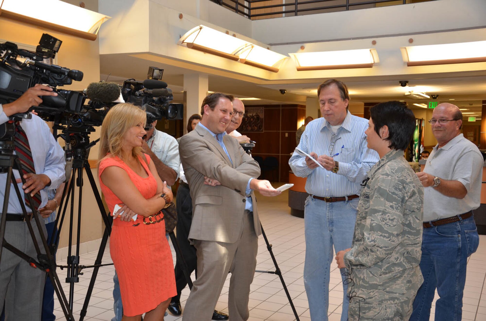 San Antonio media interview Airman Basic Shelby Goff after she saved her brother’s life at a local motel swimming pool, soon after graduating from Air Force basic training. (U.S. Air Force photo/Collen McGee)