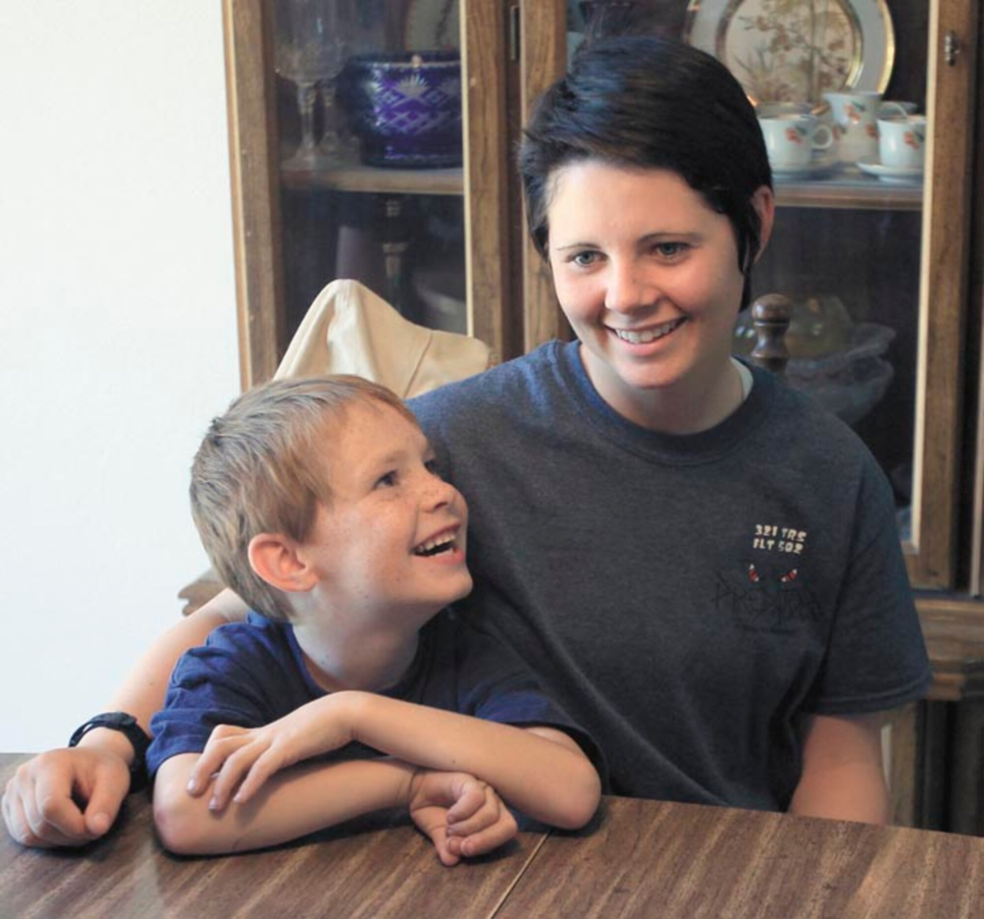 Airman Basic Shelby Goff sits with her 6-year-old brother, Amadeaus Foster, at their home in Grand Junction, Colo. (Courtesy photo, Dean Humphrey, The Daily Sentinel)