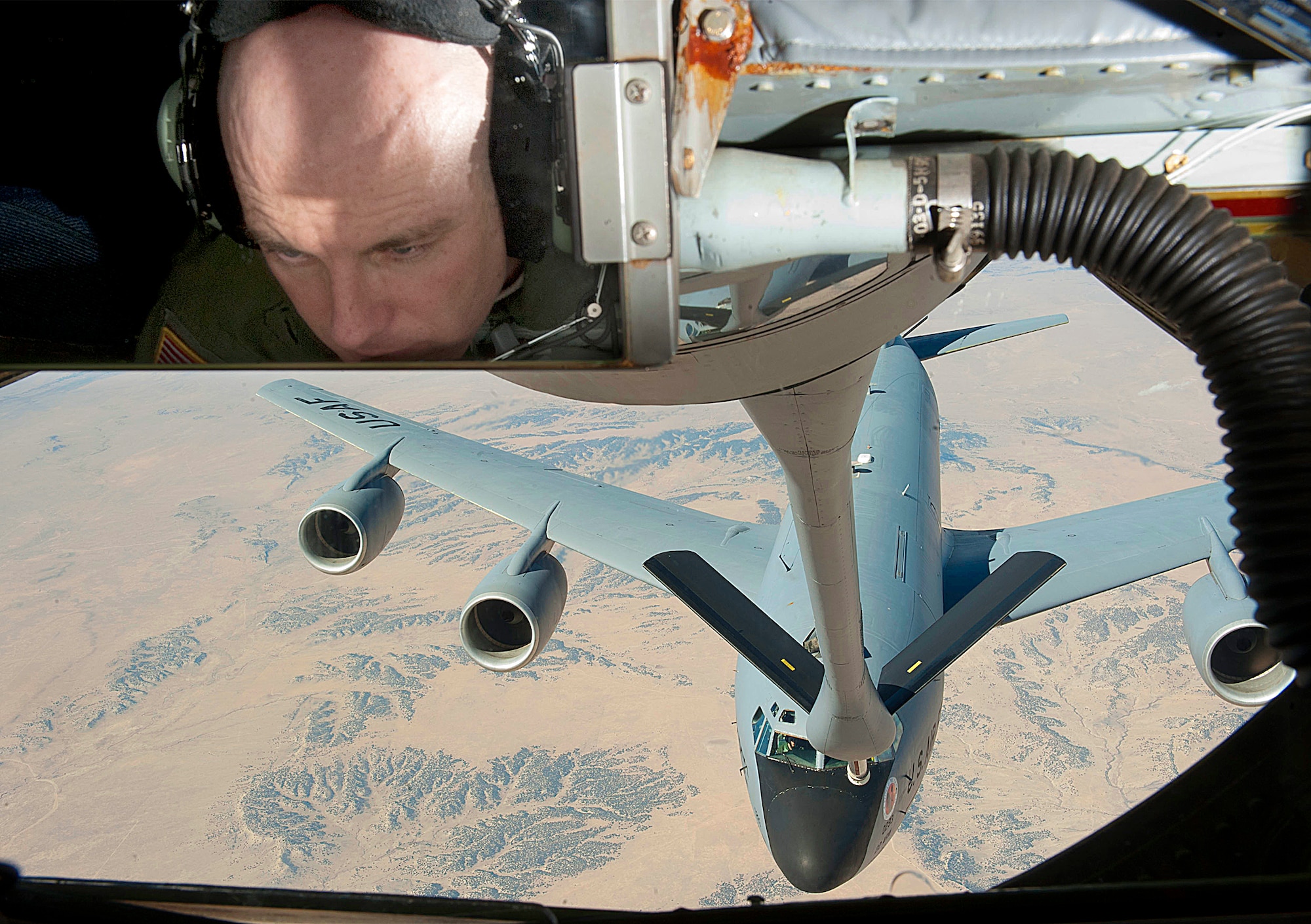 Senior Master Sgt. Ray Lewis, a refueling boom operator assigned to the Air Force Reserve 18th Air Refueling Squadron, prepares to refuel a KC-135 Stratotanker during a local training mission flown from McConnell Air Force Base, Kan., Sept. 26, 2012.  The sortie was the final local mission for the Air Force Reserve 931st Air Refueling Group for fiscal year 2012.  During the final local mission, the 931st achieved its target of flying 3,688 hours for the fiscal year.  (U.S. Air Force photo by Airman 1st Class Maurice A. Hodges)