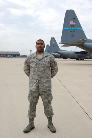Delaware Air National Guard Outstanding Noncommissioned Officer of the Year: Staff Sgt. Jomarr Hatten, 166th Logistics Readiness Squadron, a resident of Newark, Del., on the flightline next to a row of C-130 aircraft at the New Castle ANG Base, Del., April 15, 2012. (U.S. Air Force photo/Tech. Sgt. Benjamin Matwey)
