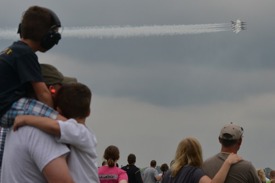 Senior Master Sgt. Rod Repp, with the 932nd Airlift Wing Maintenance Squadron, along with his two sons Rex and Reid are thrilled by the United States Air Force Thunderbirds during the 2012 Airpower Over the Midwest Air Show at Scott Air Force Base.  The 932nd Airlift Wing had a C-40C static display.  (U.S. Air Force photo/ Tech. Sgt. Christopher Parr)