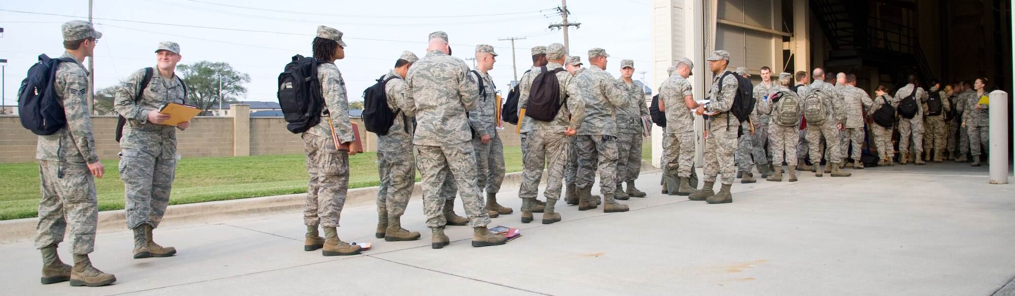 Reservists, assigned to the 512th Airlift Wing's aerial port squadron, process through a mobility line Sept. 27, 2012, on Dover Air Force Base, Del., in preparation for a six-month deployment to the Kyrgyz Republic. The 46th APS air transportation specialists will augment the airlift mission at the Transit Center at Manas in support of Operation Enduring Freedom. (U.S. Air Force photo/Adrian Rowan)