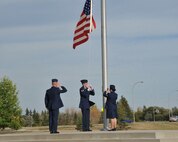 MINOT AIR FORCE BASE, N.D. -- Members of the 91st Missile Wing take part in a flag retreat ceremony here Sept. 18. The 91st MW brings its troops together periodically to promote unity, while taking part in the ceremonial procedures. (U.S. Air Force Photo/Airman 1st Class Andrew Crawford)
