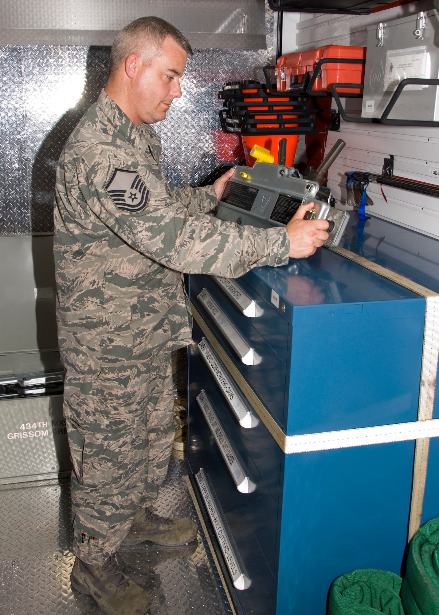 GRISSOM AIR RESERVE BASE, Ind., -- Master Sgt. Jason Drewitz, 434th Maintenance Squadron KC-135 crew chief and crash, damaged or disabled aircraft recovery team chief, inspects the equipment on a CDDAR trailer. The trailer keeps all the tools necessary to recover military aircraft in the event of an accident. (U.S. Air Force photo/Staff Sgt. Carl Berry)