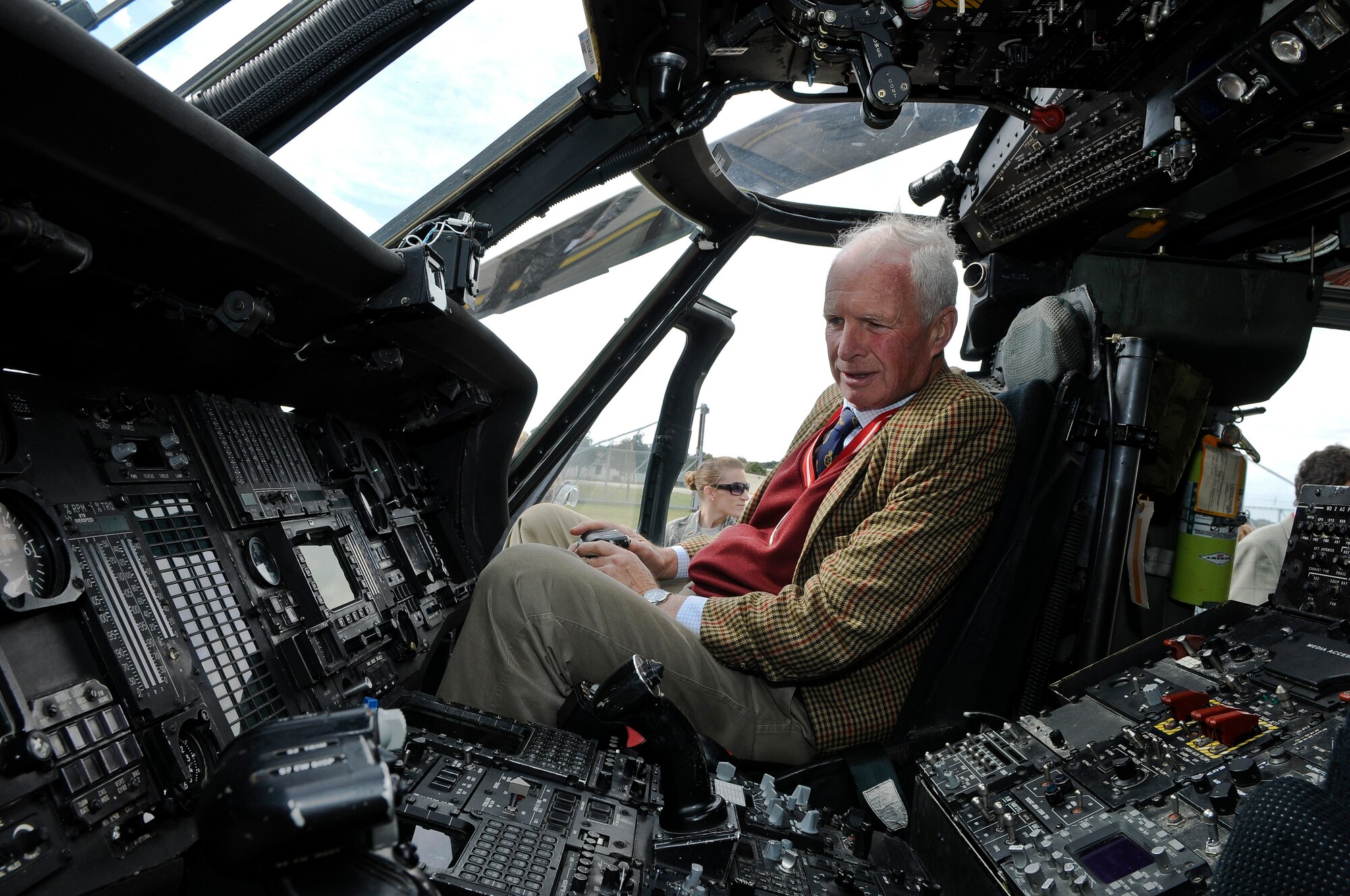 ROYAL AIR FORCE LAKENHEATH, England - Andrew Norman-Butler, Suffolk High Sheriff, sits inside the cockpit of an HH-60G Pave Hawk on the flightline, during a base visit Sept. 25, 2012. The Liberty Wing gave the High Sheriffs of Cambridgeshire, Suffolk and Norfolk, along with their spouses, tours of the 48th Maintenance Group Propulsion Facility, 48th Operations Support Squadron, static aircraft displays and other locations to continue building partnership capacities with local community leaders.  A High Sheriff is the appointed representative of the English sovereign who oversees judiciary matters and ensures law and order. (U.S. Air Force photo by Senior Airman Connor Estes)