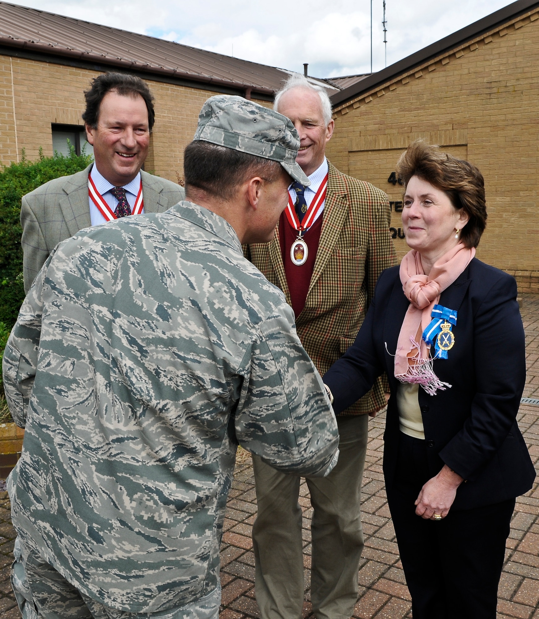 ROYAL AIR FORCE LAKENHEATH, England - Col. Mark Ciero, 48th Fighter Wing vice commander, greets Penny Walkinshaw (right), Cambridgeshire High Sheriff, Andrew Norman-Butler (middle), Suffolk High Sheriff and Henry Cator (left), Norfolk High Sheriff, during a base visit Sept. 25, 2012. The Liberty Wing gave the High Sheriffs of Cambridgeshire, Suffolk and Norfolk, along with their spouses, tours of the 48th Maintenance Group Propulsion Facility, 48th Operations Support Squadron, static aircraft displays and other locations to continue building partnership capacities with local community leaders.  A High Sheriff is the appointed representative of the English sovereign who oversees judiciary matters and ensures law and order. (U.S. Air Force photo by Senior Airman Connor Estes)