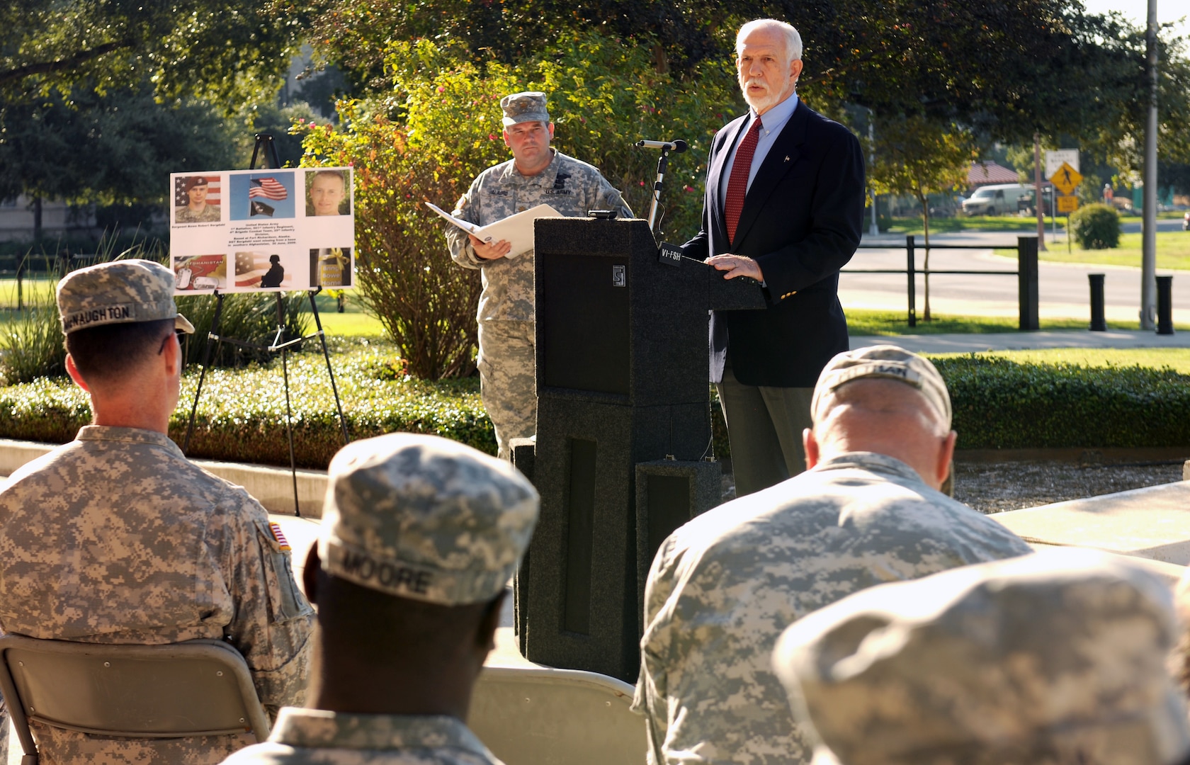 Dr. Thomas McNish, a former Vietnam prisoner of war for 6 1/2 years, speaks to U.S. Army South Soldiers and civilians during a ceremony in front of the Army South headquarters Sept. 21. The National POW/MIA Recognition Day ceremony recognized and honored those who have been imprisoned and those missing while defending the nation. The ceremony concluded with the raising of the POW/MIA flag on the flagpole in front of the ARSOUTH headquarters.    Photo by St. Tamika A. Exom