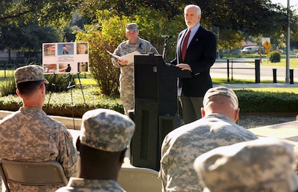 Dr. Thomas McNish, a former Vietnam prisoner of war for 6 1/2 years, speaks to U.S. Army South Soldiers and civilians during a ceremony in front of the Army South headquarters Sept. 21. The National POW/MIA Recognition Day ceremony recognized and honored those who have been imprisoned and those missing while defending the nation. The ceremony concluded with the raising of the POW/MIA flag on the flagpole in front of the ARSOUTH headquarters.    Photo by St. Tamika A. Exom