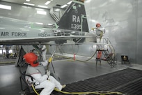 John Esquivel (left), and Daniel Perez, 12th Flying Training Wing Maintenance Division media blast technicians, prepare to use use corn starch to strip the paint from a T-38 Talon at Joint Base San Antonio-Randolph, Sept. 20. Two materials 12th FTW shops air blast to remove paint from T-1, T-6, T-38 and F-16 aircraft are plastic and corn starch, which have been deemed environmentally safe by the Air Force. Randolph generates about 20,000 pounds of plastic and 28,500 pounds of corn starch annually that is recycled.  The excess plastic is shipped to Canton, Ohio, where it is manufactured into products such as simulated marble tiles and dog bowls.  (U.S. Air Force photo by Rich McFadden) 