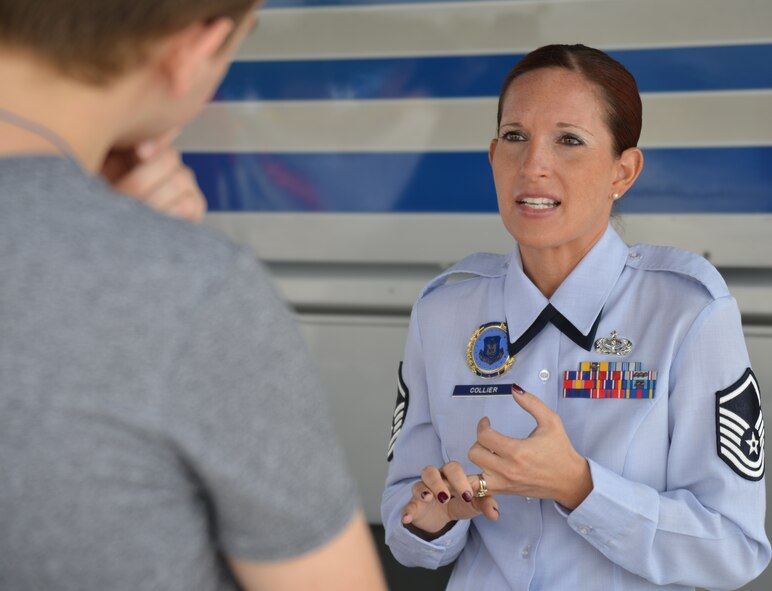 Master Sgt. Christa Collier, recruiter with the 932nd Airlift Wing, talks with a recent high school graduate about various jobs within the Air Force Reserve Command.  The 932nd Airlift Wing is the only AFRC flying wing in Illinois.  (U.S. Air Force photo/ Tech. Sgt. Christopher Parr)